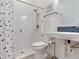 Neat bathroom with a tiled shower and an elevated sink with blue backsplash at 6057 Marsh Trail Dr, Odessa, FL 33556