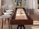 Well-appointed game room featuring a shuffleboard table with modern chairs at 6057 Marsh Trail Dr, Odessa, FL 33556