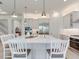 A spacious white kitchen island with stainless steel appliances and comfortable seating at 6057 Marsh Trail Dr, Odessa, FL 33556