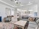 Open-concept living space with seamless flow between the living area, kitchen, and staircase, creating an inviting atmosphere at 6057 Marsh Trail Dr, Odessa, FL 33556