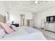 Bright main bedroom with trey ceilings, white furniture, and ensuite entrance at 6057 Marsh Trail Dr, Odessa, FL 33556