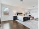 Bright main bedroom with hardwood floors, a work out area, and lots of natural light at 6057 Marsh Trail Dr, Odessa, FL 33556