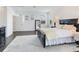 Bright main bedroom with hardwood floors, a bedside table, and plenty of natural light at 6057 Marsh Trail Dr, Odessa, FL 33556
