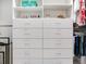 Custom built-in shelving in a walk-in closet for optimal storage and organization at 6057 Marsh Trail Dr, Odessa, FL 33556