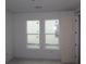 Bright bedroom with two windows, featuring a neutral palette and ample natural light at 640 Allora Ave, Nokomis, FL 34275