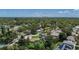 An aerial view of a home in a lush neighborhood with city views at 675 69Th S Ave, St Petersburg, FL 33712