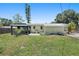Spacious backyard with gazebo, mature trees and rock garden at 675 69Th S Ave, St Petersburg, FL 33712