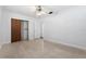 Bright bedroom with light walls, a ceiling fan, and a closet at 675 69Th S Ave, St Petersburg, FL 33712