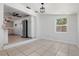 Well-lit dining area with tile flooring, connecting seamlessly to the kitchen, ideal for gatherings at 675 69Th S Ave, St Petersburg, FL 33712