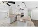 Kitchen showcasing stainless steel appliances, stylish tile flooring, and plenty of counter space at 675 69Th S Ave, St Petersburg, FL 33712