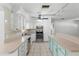 Kitchen featuring stainless steel appliances, light cabinets, and tiled floors at 675 69Th S Ave, St Petersburg, FL 33712