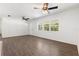 Bright living room featuring new flooring, large windows, and ceiling fans at 675 69Th S Ave, St Petersburg, FL 33712