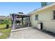 A backyard patio with a gazebo and a grill at 675 69Th S Ave, St Petersburg, FL 33712