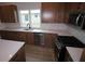 Modern kitchen featuring stainless steel appliances, white countertops, and ample storage space at 699 Allora Ave, Nokomis, FL 34275