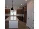 Spacious kitchen with a large island, modern appliances, and wood floors at 699 Allora Ave, Nokomis, FL 34275