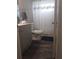 Bathroom features updated vanity with stone countertop and stylish fixtures at 702 Cypress Pl, Sun City Center, FL 33573