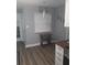 Charming breakfast nook area, adjacent to the kitchen, with a vintage sewing machine table at 702 Cypress Pl, Sun City Center, FL 33573