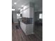 Bright kitchen features white cabinets, stylish backsplash, and stainless steel appliances at 702 Cypress Pl, Sun City Center, FL 33573