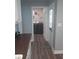 Convenient laundry room with new appliances, open doorway, and durable wood-look flooring at 702 Cypress Pl, Sun City Center, FL 33573