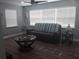 Living room has multiple windows for natural light and comfortable seating area at 702 Cypress Pl, Sun City Center, FL 33573
