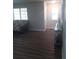 Inviting living room features hardwood floors and a front entryway at 702 Cypress Pl, Sun City Center, FL 33573