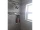 Updated shower features tiled walls, built in shelving at 702 Cypress Pl, Sun City Center, FL 33573