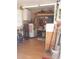 Storage room with organizing shelves, cleaning supplies, and water heater at 702 Cypress Pl, Sun City Center, FL 33573