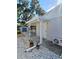 Backyard view with covered area, shed, mini split, and stone pathway enhancing the outdoor space and its features at 7427 Banner St, New Port Richey, FL 34653