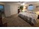 Cozy bedroom featuring a comfortable bed with floral bedding and a ceiling fan for a relaxing ambiance at 7427 Banner St, New Port Richey, FL 34653