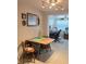 Bright dining space with decor and a view into the office, illuminated by track lighting at 7427 Banner St, New Port Richey, FL 34653