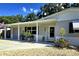 Inviting exterior view of home with cozy front porch, well-maintained landscaping, and charming curb appeal at 7427 Banner St, New Port Richey, FL 34653