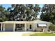 Charming single-story home with gray brick and manicured landscaping at 7427 Banner St, New Port Richey, FL 34653