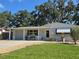 Charming single-story home featuring a well-manicured lawn and welcoming facade at 7427 Banner St, New Port Richey, FL 34653