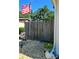 Charming front yard featuring stone address plaque, American flag, and tasteful landscaping enhancing the property's appeal at 7427 Banner St, New Port Richey, FL 34653