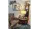 Charming living area with floral armchair, grandfather clock, and decorative accents at 7427 Banner St, New Port Richey, FL 34653