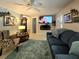 Comfortable living room featuring a TV, fireplace, and cozy seating at 7427 Banner St, New Port Richey, FL 34653