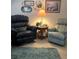 Cozy living room featuring armchairs, a side table and decorative wall art at 7427 Banner St, New Port Richey, FL 34653
