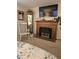 Cozy bedroom featuring a fireplace, rocking chair and decorative accents at 7427 Banner St, New Port Richey, FL 34653