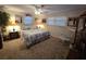 Serene bedroom with a comfortable bed, soft lighting, and carpeted floor at 7427 Banner St, New Port Richey, FL 34653