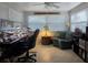 Home office with a desk, computer, chair and a comfortable loveseat for focused work at 7427 Banner St, New Port Richey, FL 34653
