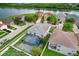 Aerial view of community with home and screened pool near the lake at 7515 Dragon Fly Loop, Gibsonton, FL 33534