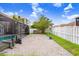 Spacious backyard patio with a white picket fence and plenty of room to relax at 7515 Dragon Fly Loop, Gibsonton, FL 33534