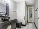 Modern bathroom with vessel sink, black fixtures, and decorative mirror at 7515 Dragon Fly Loop, Gibsonton, FL 33534