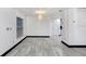 Bright and open living room showcasing sleek flooring, stylish lighting, and large windows with natural light at 7515 Dragon Fly Loop, Gibsonton, FL 33534