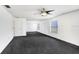 Large living room featuring a ceiling fan and windows at 7515 Dragon Fly Loop, Gibsonton, FL 33534