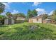 This large backyard has mature trees, lots of space for activities and room to build a patio at 8606 N 9Th St, Tampa, FL 33604
