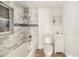 Bathroom featuring a tub and shower combination with updated tile, and a vanity sink at 8606 N 9Th St, Tampa, FL 33604