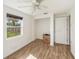 Bright bedroom featuring tile flooring, a window with natural light, and a closet at 8606 N 9Th St, Tampa, FL 33604