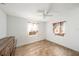 Bedroom featuring wood-look tile flooring, ceiling fan, neutral paint, and bright windows at 8606 N 9Th St, Tampa, FL 33604