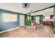 Open-concept living space featuring tile floors, updated light fixtures, and abundant natural light at 8606 N 9Th St, Tampa, FL 33604